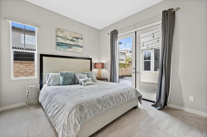 First Floor Gen Suite Bedroom with California King Bed, Walk-in Closet & Access to Yard