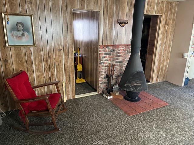 Living room, showing swiss stove.