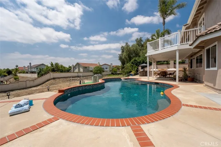 The pool and spa were upgraded in 2022 with dual drains, new pebble tech surface, new lights, new heater and filter system with wireless controls.  The spacious deck is TimberTech® for a beautiful look and durability.