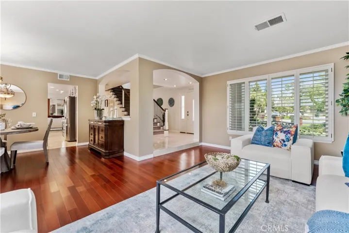 From this corner of the living room you can see (beginning from the left): the dining room, kitchen and front entry.