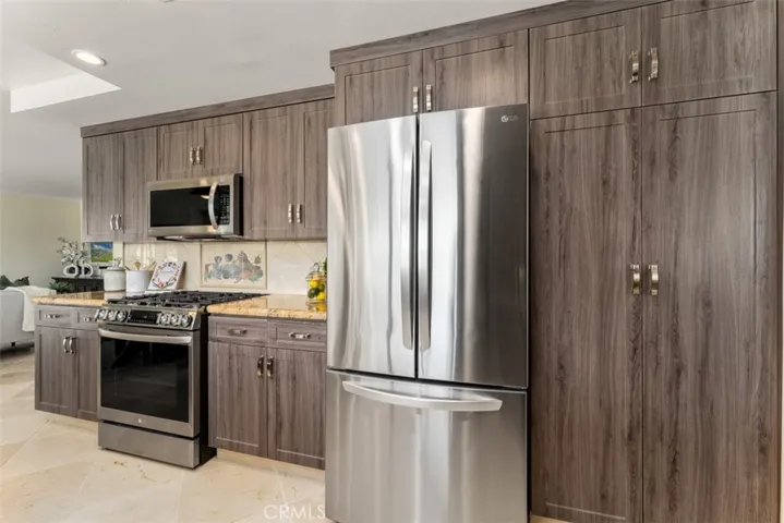 Kitchen features soft-close cabinets and drawers, pantry, spice drawers, and several cabinets have pull-out drawers
