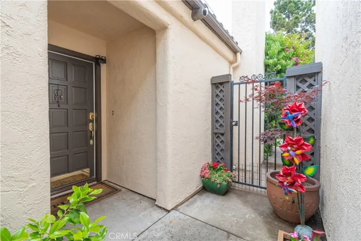 Front door and fence to side yard