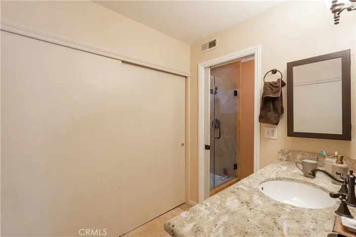 Master Bathroom with upgraded countertops and tile shower.  Door for toilet and shower for privacy.