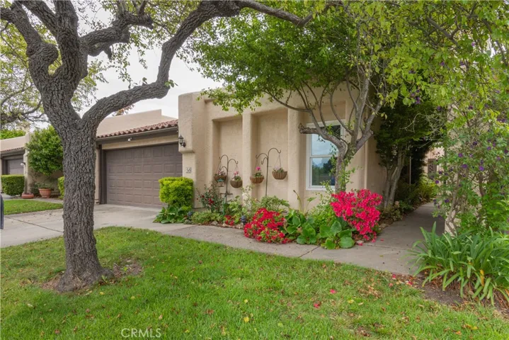 Front entrance to residence.  Landscaping maintained by HOA.
