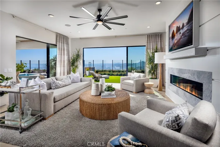 Family Room: Sunset Coastal Contemporary - Skyline Collection
INCLUSIONS: Fully Furnished model home, professionally decorated with designer finishes throughout and lush landscaping. 
EXCLUSIONS: Model home sold as is.