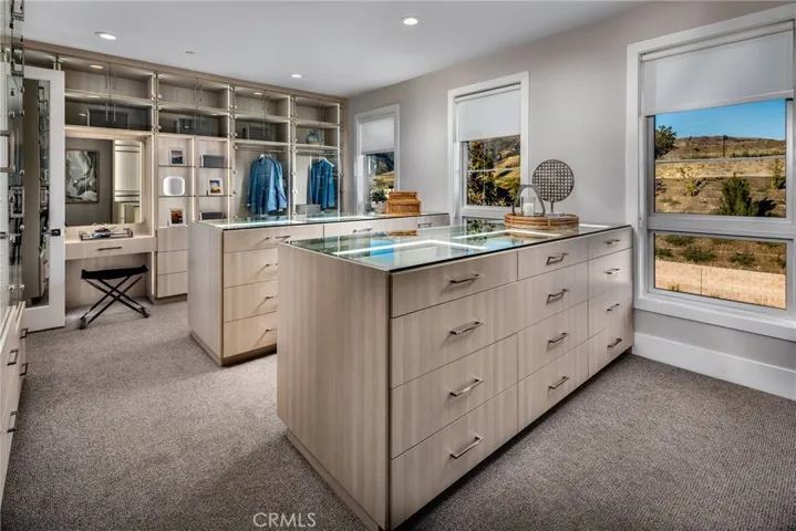 Primary Bedroom Closet: Sunset Coastal Contemporary - Skyline Collection
INCLUSIONS: Fully Furnished model home, professionally decorated with designer finishes throughout and lush landscaping. 
EXCLUSIONS: Model home sold as is.