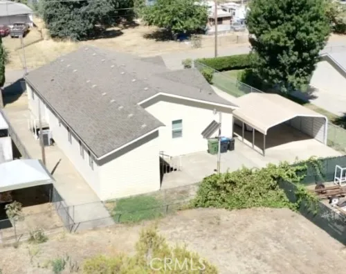 Rear view of home and private concrete patio