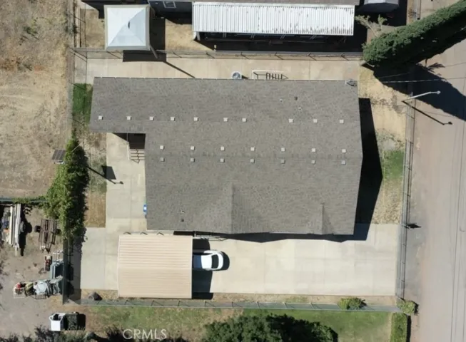 Large driveway with covered parking area.  RV hookups in driveway and fully fenced yard.