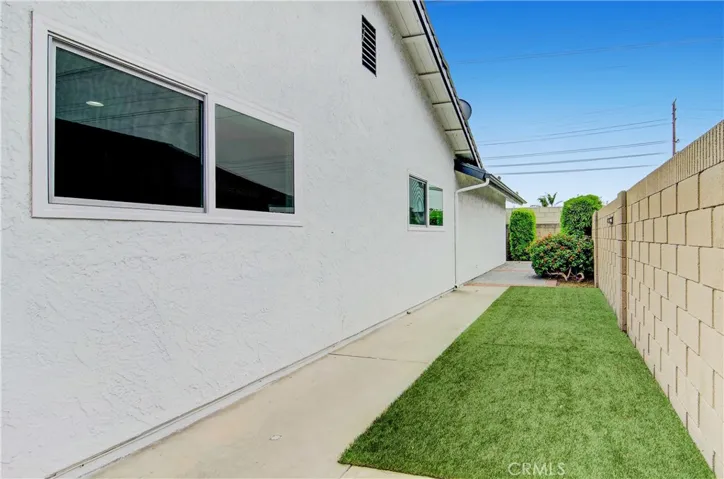 Side of home perfect for pets to lay and relax or space for shed