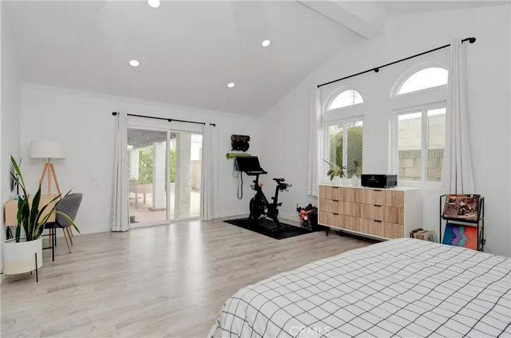 Master Bedroom. Sliding doors to backyard lounge. Half crescent windows with dual pane temperature windows. Large space for vanity and peloton