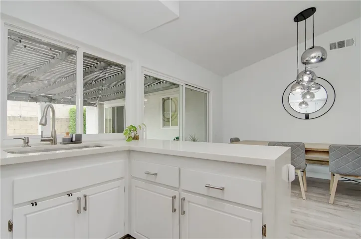 Newly installed sliding doors leading from kitchen to outdoor private lounge. Clear line of sight perfect for entertaining