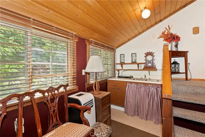 Seating Area, Wet Bar And Outside Access In Main Bedroom