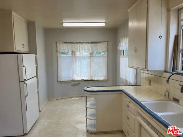 Original kitchen looking toward breakfast area