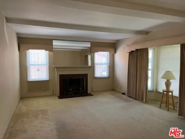 Large isolated Family room with open beam ceilings