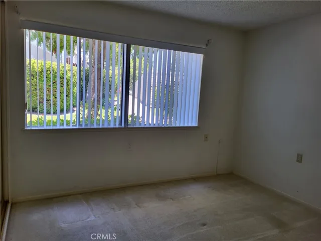 bedroom view of greenbelt, carpets to be professionally cleaned