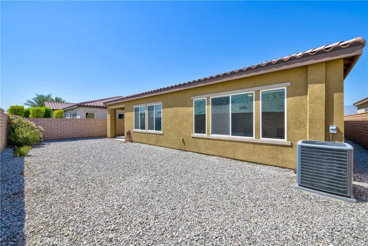 So many possibilities for this spacious back yard!
