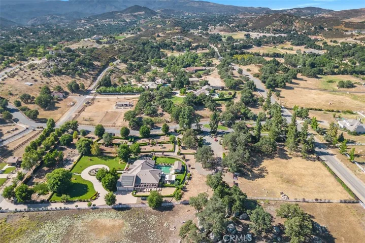 Plenty of usable land for horse facilities, guest home, car barn, tennis court, groves, vineyards or anything else ones heart may desire