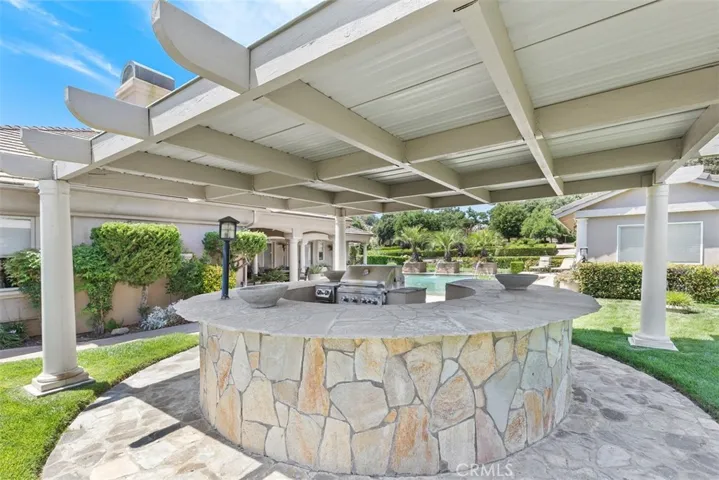 outdoor kitchen with expansive entertainment counter