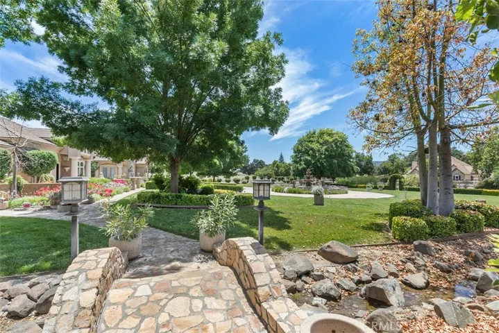 custom rock bridge, walk ways and stream