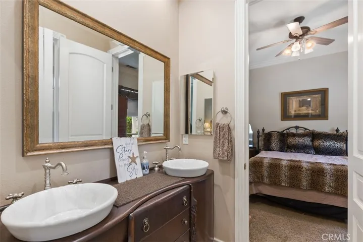 secondary bathroom with two sinks