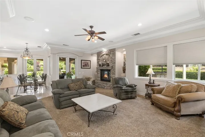 Family room open to the kitchen with direct access to pool area