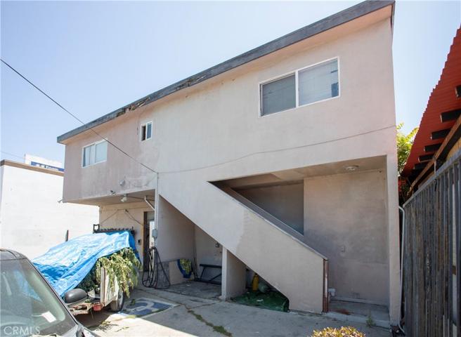 Rear View with Stairway to Apartment Condo Above
