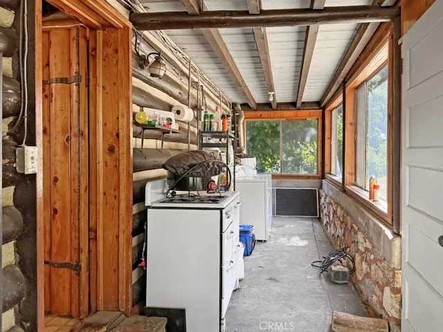 Log Cabin enclosed back porch/mud room.