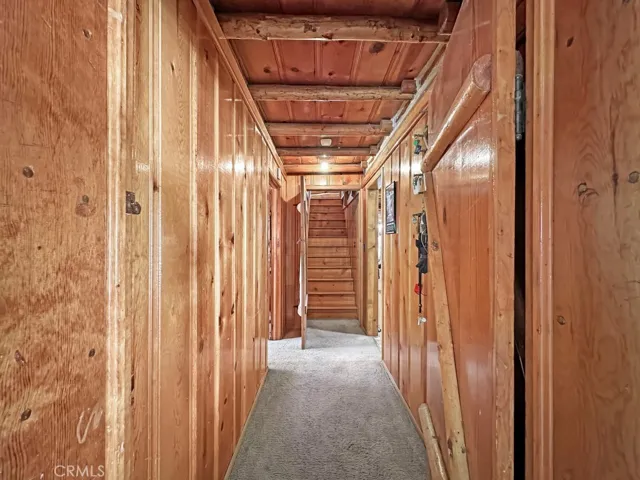 Log Cabin downstairs hallway. Storage galore and doors which can be opened or kept closed for energy savings.
