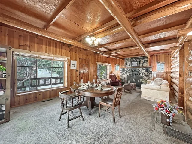 Log Cabin Dining and Living Room. Large picture windows overlook Main Street below.