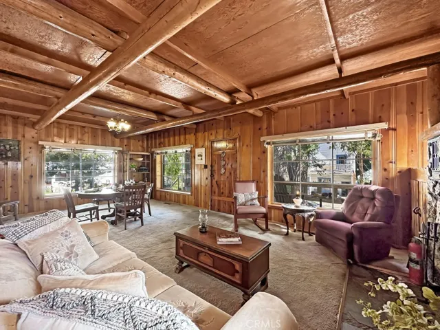 Log Cabin Living Room. So much character and gleaming knotty pine walls.