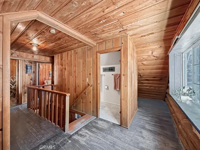 Log Cabin upper level landing. Space and storage everywhere.