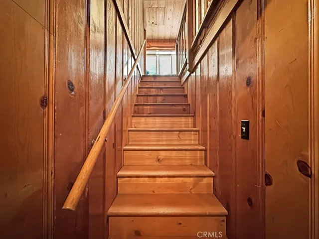 Log Cabin stairway to upper level rooms.