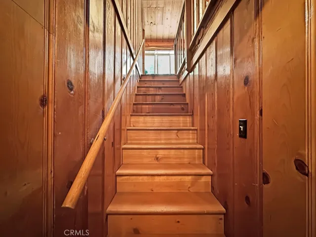 Log Cabin stairway to upper level rooms.