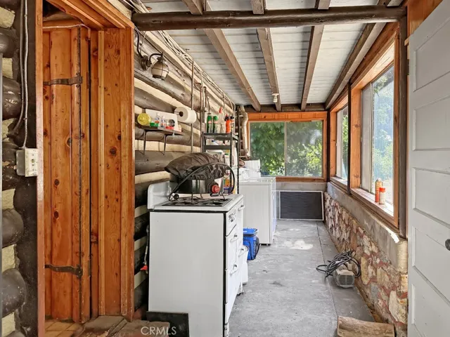 Log Cabin enclosed back porch/mud room.