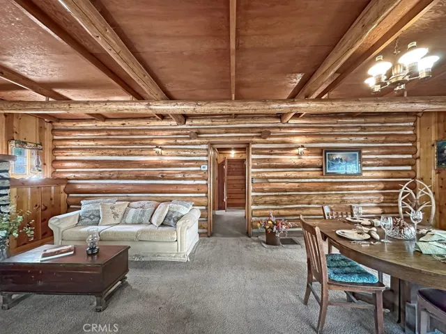 Cozy Log Cabin Living Room and Dining Area.