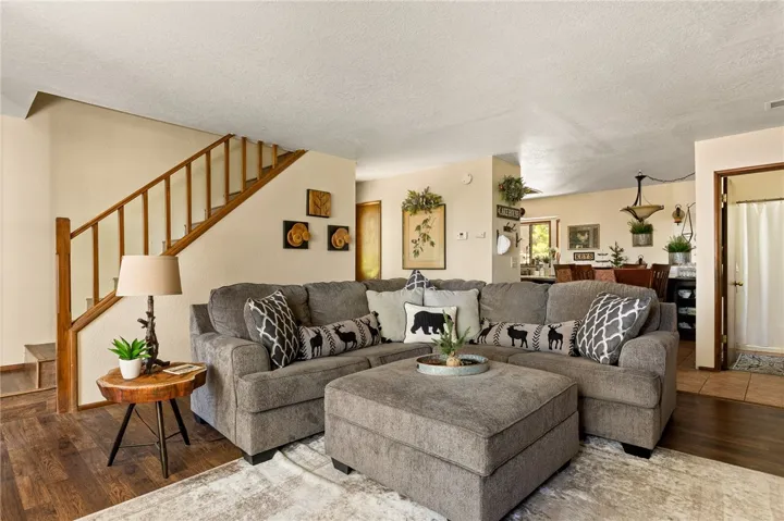 Spacious living room great for hanging out and entertaining with lots of room for Holiday decorating!