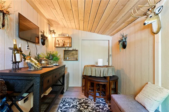 Customized wine tasting room at the lowest level with door out to the backyard.