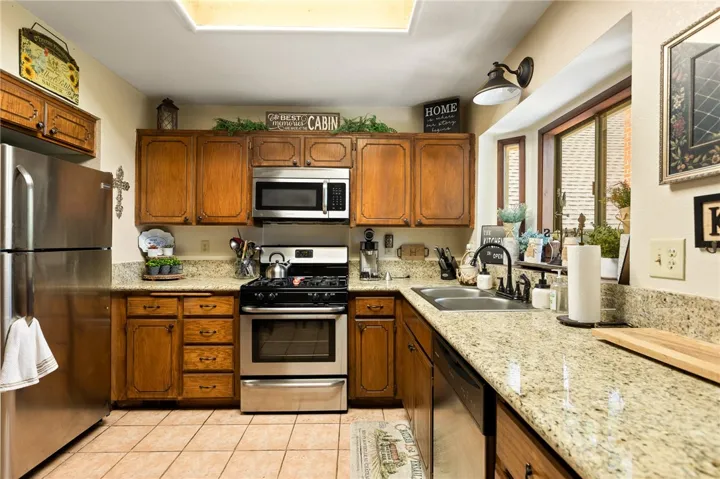 Kitchen is spacious with granite counter tops, great Bay window, upgraded faucets and stainless steel appliances.