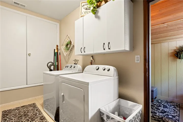 Indoor laundry room off the garage and downstairs room.