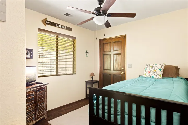 Bedroom offers solid wood raised panel door.