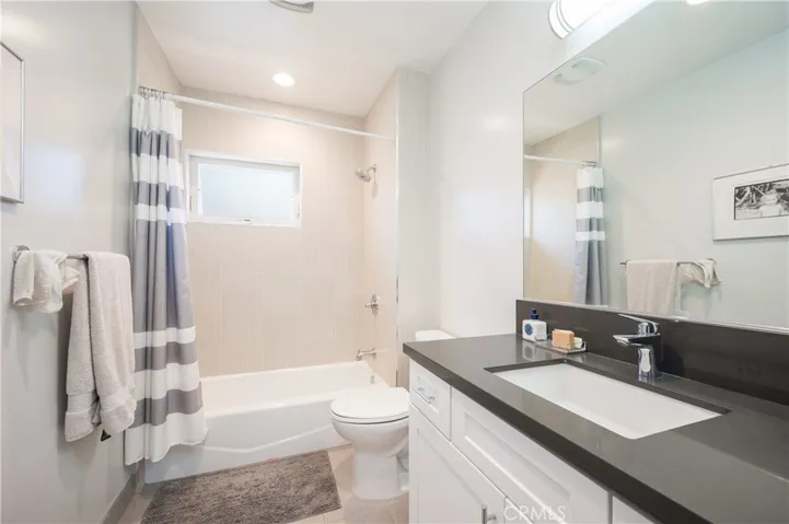 2ND FLOOR FULL BATH/SHOWER CAST IRON KOHLER TUB WITH TILE SURROUND