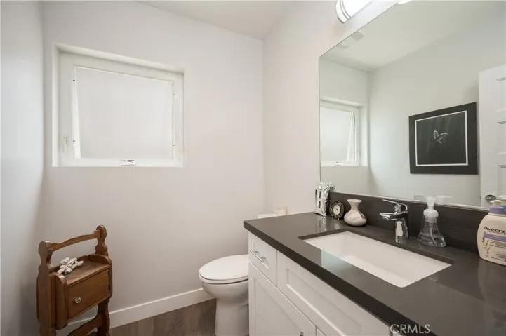 1ST FLOOR GUEST BATHROOM QUARTZ STONE SLAB WITH 6" BACK SPLASH