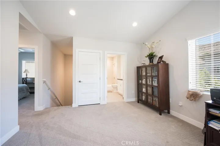 FROM LOFT LOOKING AT WASHER & DRYER (INCLUDED) CLOSET AND BEAUTIFUL FULL BATHROOM
