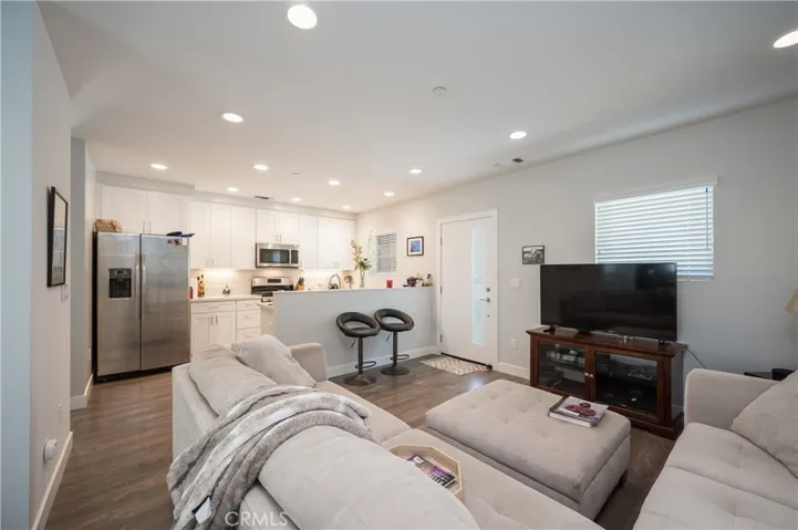 OPEN CONCEPT LIVING WITH ENGINEERED HARDWOOD FLOORING