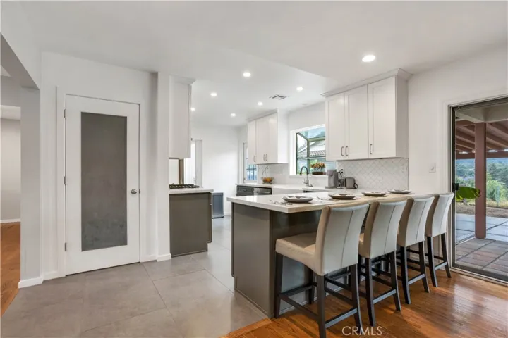 Light, bright and open family kitchen/great room feel.