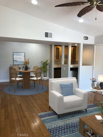 Virtual Staging Photo from Family Room to Dining Room & entry to Kitchen.