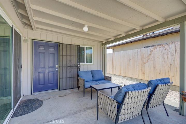 Covered patio off Primary and bonus room.