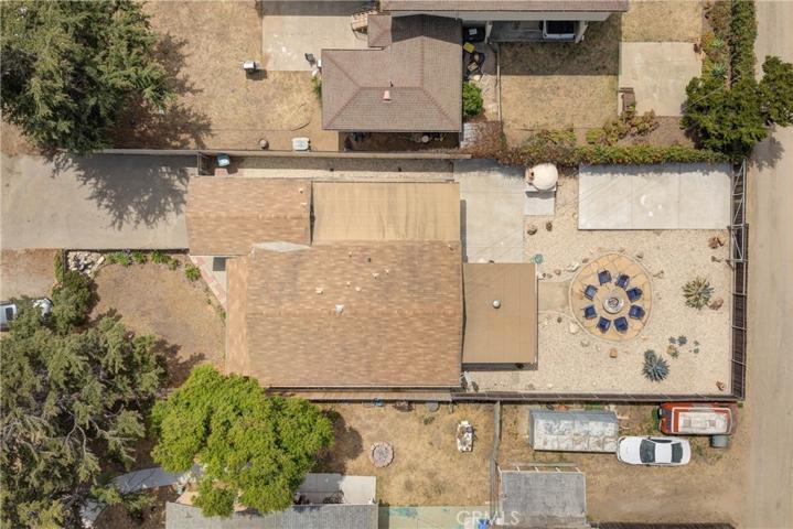 Overhead view of property, concrete RV pad visible.