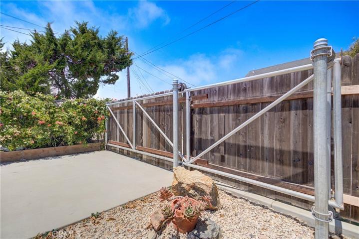 Alleyway access gate for RV parking pad