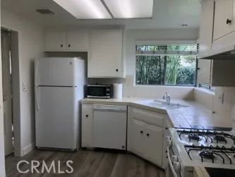 Freshly painted kitchen including cabinets and pantry